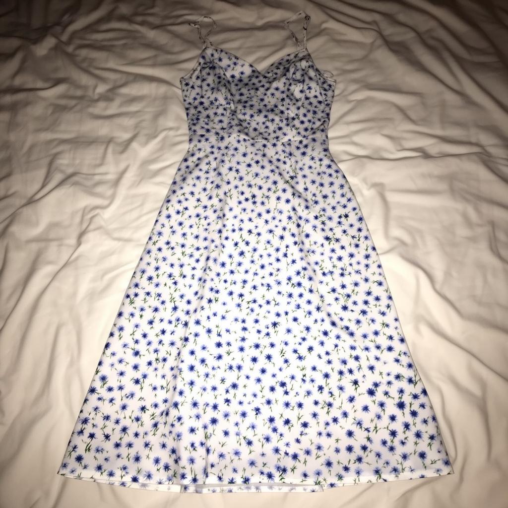 Dress laid flat on a bedsheet